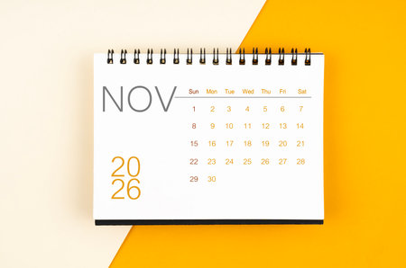 Desk calendar for November 2026 year on yellow color background.の写真素材