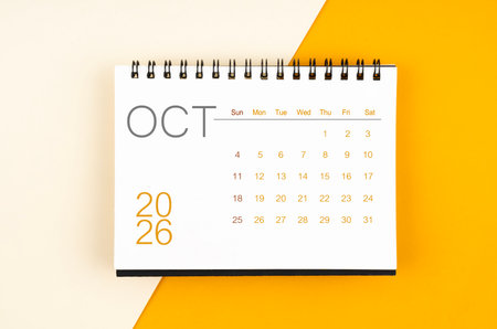Desk calendar for October 2026 year on yellow color background.の写真素材