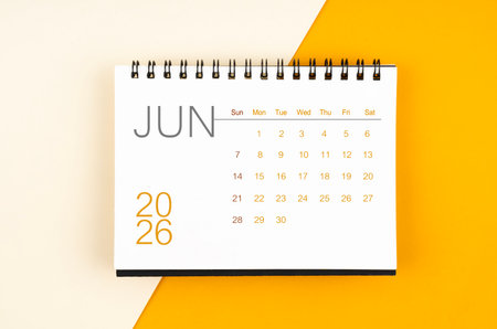 Desk calendar for June 2026 year on yellow color background.の写真素材