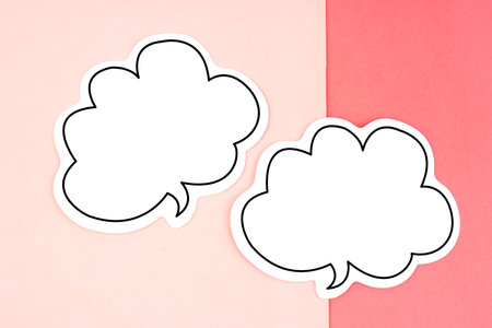 Speech bubble with copy space communication talking speaking concepts on pink background.