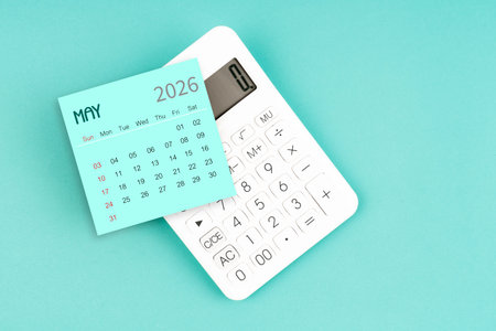 May 2026 calendar card with calculator on blue background.