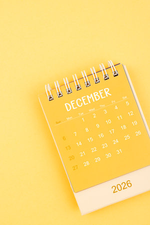 December 2026 Yellow desktop calendar on a yellow background.の写真素材