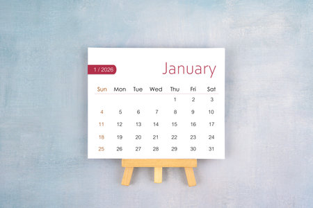 January 2026 calendar page with wooden easel.
