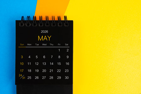 Black mini calendar for May 2026 on multi background.
