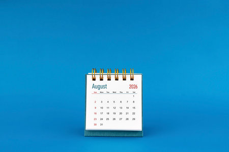 August 2026 mini desk calendar on blue background.の写真素材