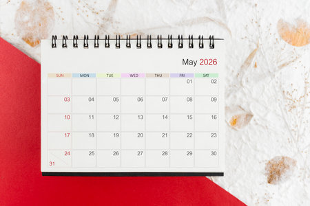 May 2026 blank desk calendar on mulberry paper, Flat lay.