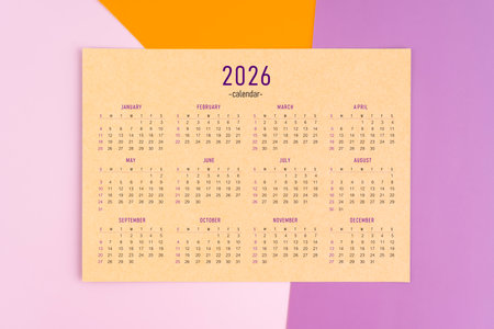 2026 yearly calendar page on colorful background, Flat lay.の写真素材