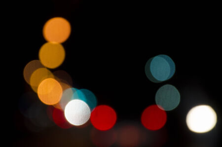 Out of focus lights of a public street during night timeの写真素材