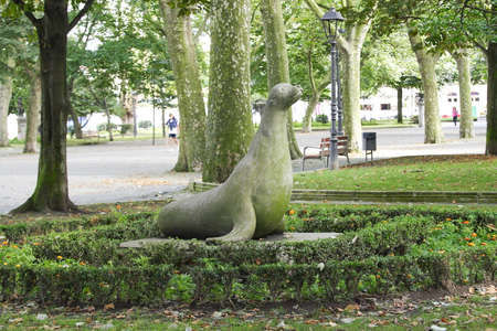 AvilÃ©s, Spain - July 27, 2019: Monument of seadog of stone in a parkのeditorial素材