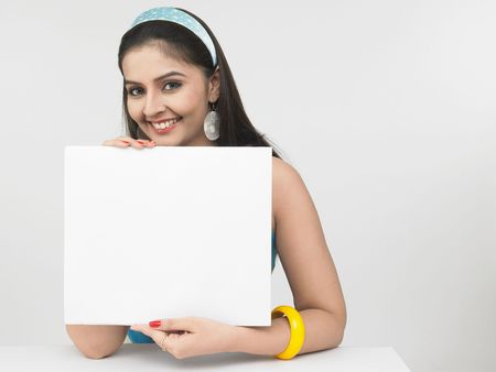 asian female with a blank placardの写真素材