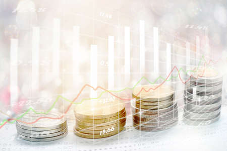 Coins stack in front of bank account book Savings money of coins concept for saving or investment...