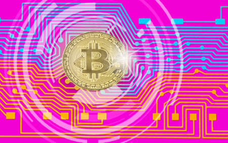 Golden bitcoin digital currency. - Printed circuit board with bitcoin processor and microchipsの写真素材