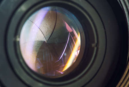 Camera lens with lense reflections modern ultra zoom photo camera front view,black DSLR camera,の写真素材