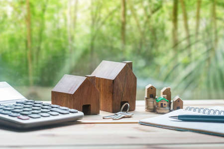 House placed on coins is planning savings money of coins to buy a home concept concept for property ladder, mortgage and real estate investment.  for saving or investment for a house,の写真素材