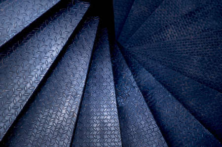 Spiral steel staircase circular staircase decoration interior. travel and architecture background.spiral staircase dark colorの写真素材