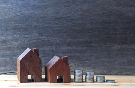 House placed on coins is planning savings money of coins to buy a home concept concept for property ladder, mortgage and real estate investment. for saving or investment for a house,の写真素材