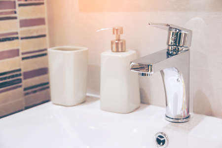 Interior of bathroom with sink basin faucet and mirror. Modern design of bathroom.の写真素材