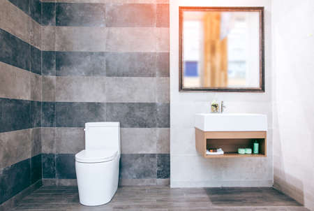 White toilet bowl in the bathroom with shower tiles and comfortable.の写真素材