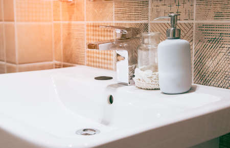 Interior of bathroom with sink basin faucet and mirror. Modern design of bathroom.