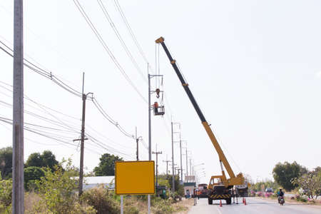 Engineer Electrician Workers On Repairing electrician work installation of high voltage in high voltage stations safely and systematically overの写真素材