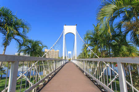 The white suspension bridge in the park of Udon Thani Province in Thailand.の写真素材