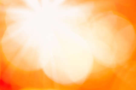 Happy holiday backgrounds. Abstract cute festive light golden yellow bokeh background texture with defocused lights. Christmas lights, blurry lights, glitter sparkle. Beautiful texture.の写真素材