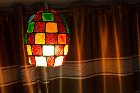 Colorful lamps lanterns hanging on the ceiling. Elegant modern shape lampの写真素材