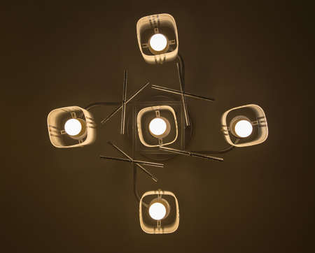 Close-up of a beautiful crystal chandelier Beautiful chandelier. luxury expensive chandelier hanging under ceilingの写真素材