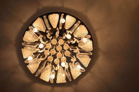 Close-up of a beautiful crystal chandelier Beautiful chandelier. luxury expensive chandelier hanging under ceilingの写真素材