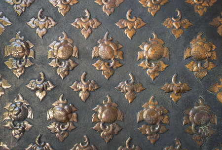 Copper lacquer Show flower art balance Global Crafts Thai artists. Place in Chiang Mai, Thailand. gold wall ,Thai traditional art in temple,Thailand. Decorative Art of Lanna Thai. Silver engravingの写真素材