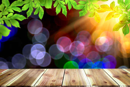 Empty dark wooden table in front of abstract blurred bokeh background. can be used for display or montage your products.Mock up for spaceの写真素材