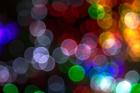colorful Bokeh Background. Abstract light celebration background with defocused golden lights for Christmas, New Year, Holiday, partyの写真素材