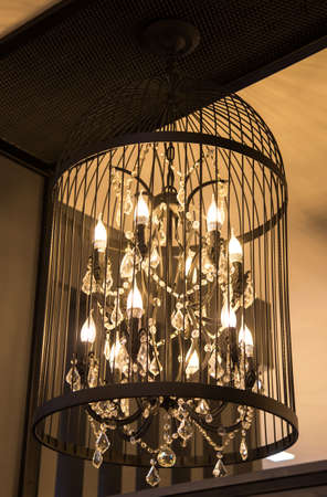 Close-up of a beautiful crystal chandelier Beautiful chandelier. luxury expensive chandelier hanging under ceilingの写真素材