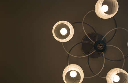 Close-up of a beautiful crystal chandelier Beautiful chandelier. luxury expensive chandelier hanging under ceilingの写真素材