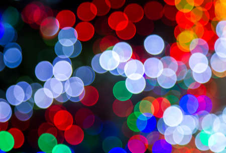 colorful Bokeh Background. Abstract light celebration background with defocused golden lights for Christmas, New Year, Holiday, partyの写真素材