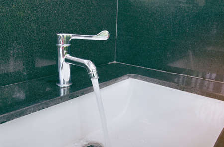Interior of bathroom with sink basin faucet and mirror. Modern design of bathroom.の写真素材
