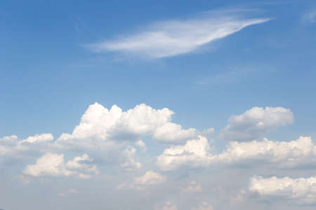 The vast sky and the white clouds float in the sky. The natural blue background has a breeze on a bright day in the summer.The sky and clouds are not the same shape as the weather.の写真素材
