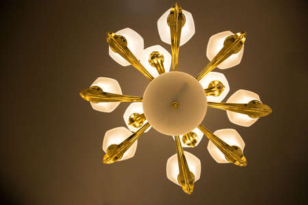 Close-up of a beautiful crystal chandelier Beautiful chandelier. luxury expensive chandelier hanging under ceilingの写真素材