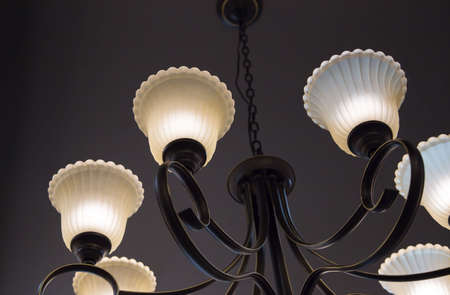 Close-up of a beautiful crystal chandelier Beautiful chandelier. luxury expensive chandelier hanging under ceilingの写真素材