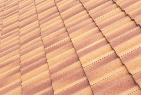 Roof tiles and sky sunlight. Roofing Contractors concept Installing House roof.の写真素材