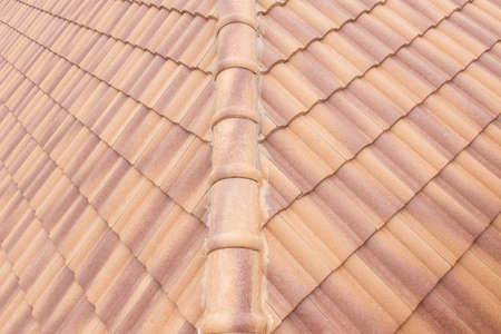 Roof tiles and sky sunlight. Roofing Contractors concept Installing House roof.の写真素材