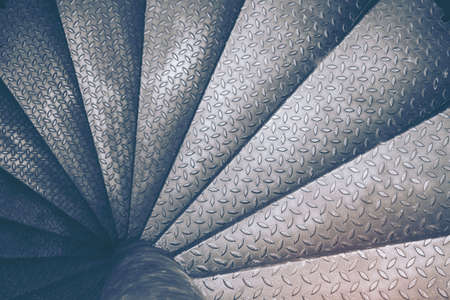 Spiral steel staircase circular staircase decoration interior. travel and architecture background.spiral staircase dark colorの写真素材