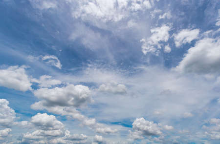 The vast sky and the white clouds float in the sky. The natural blue background has a breeze on a bright day in the summer.The sky and clouds are not the same shape as the weather.の写真素材