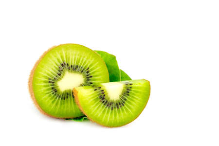 Ripe whole kiwi fruit and half kiwi fruit and green leaves isolated on white backgroundの写真素材