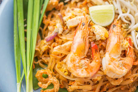 Pad Thai - Rice noodles with shrimps and vegetables close-up on the table. top view of a horizontalの写真素材