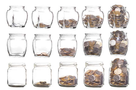Glass jars with coins like diagram isolated on White Background. The Collection Glass jars with coins. savings conceptの写真素材