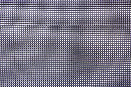 Macro shot of the surface of the LSD screen. A texture to overlay to your still photo or footage to simulate an lcd pc screen shot or video. Macro detail of the dot grid.の写真素材