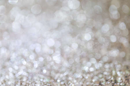 white abstract background sparkle bokeh blurred beautiful shiny lights flare Christmasの写真素材