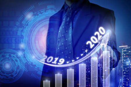 Business development to success and growing growth year 2019 to 2020 concept, Businessman pointing arrow graph corporate future growth planの写真素材