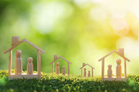 wooden doll couple stand in house model, self-quarantine and stay safe at home concept for Coronavirus, 2019-NCOV or COVID19 prevention, Stay home during the coronavirus  epidemic.の写真素材